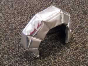 Passgenaue Thermoisolierung dämmt einen Turbolader Thermoisolierung als Abdeckung für einen Turbolader